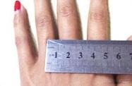 Place the ring on a ruler and view vertically from above the arrow mark to read the inner diameter.