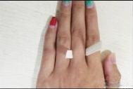 Wrap a thin paper strip around your finger where you plan to wear the ring.