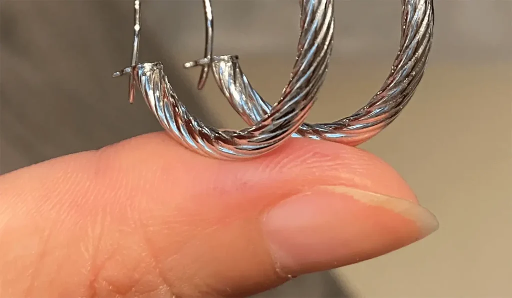 Close-up of modern earrings featuring twisted line design for a stylish