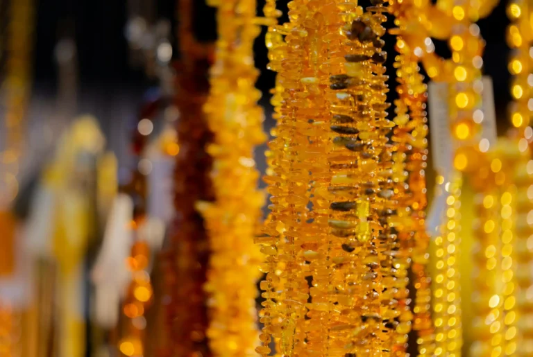 Beautiful amber necklace with yellow and golden hues, illustrating natural gemstone colors and elegance for jadeite identification guide.