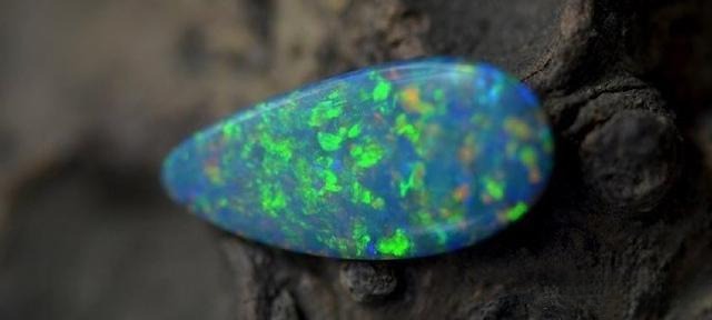 Natural opal rough showcasing its raw texture and vibrant colors.