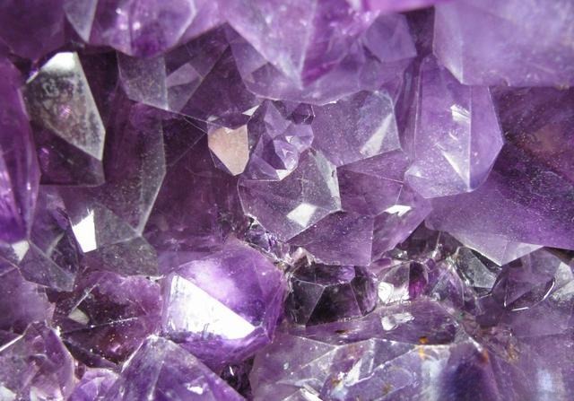 Natural purple quartz crystal specimen showing vivid violet hue and transparent structure.