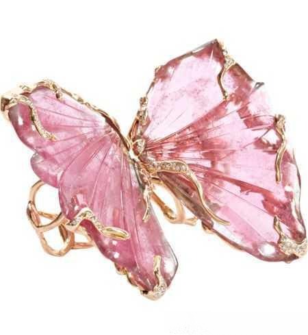 Natural stone butterfly brooch adorned with colorful gemstones, showcasing vivid hues and exquisite craftsmanship in fine jewelry design.