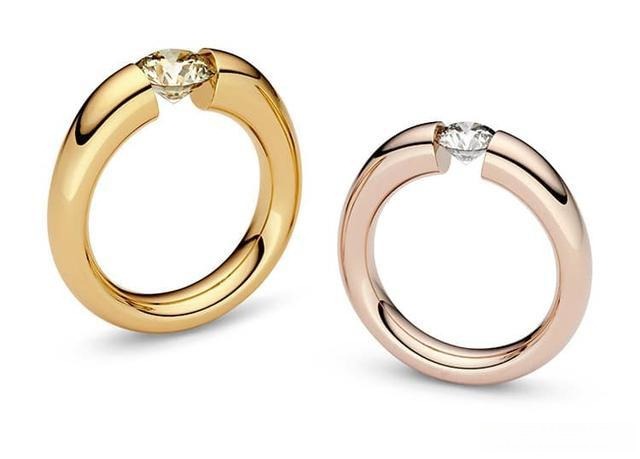 Niessing tension-set diamond ring, showcasing a modern design that suspends the diamond using pure metal pressure for maximum light exposure and brilliance.