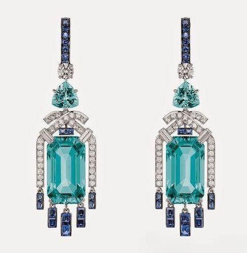 Paraiba tourmaline earrings showcasing vivid blue-green color caused by trace copper elements, admired for their radiant brilliance and rarity.