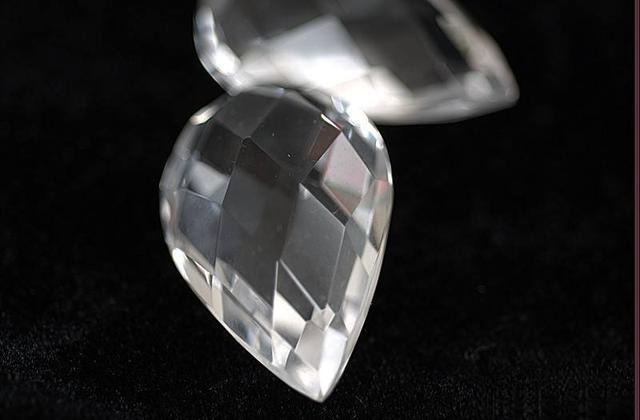 Pear-shaped white quartz gemstone with low dispersion, expertly cut to maintain soft, elegant sparkle without intense fire