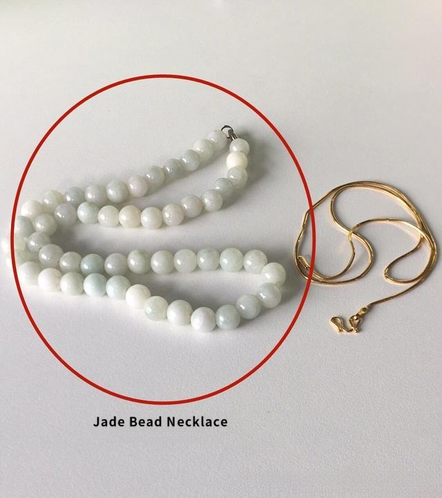 Plain jade bead necklace before jewelry redesign, flat and lacking visual focal point