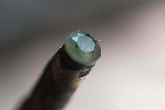 Polished table and star facets of the gemstone, revealing its interior with remarkable clarity