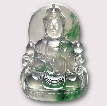 Seated Guanyin statue carved from premium jadeite with excellent texture and translucency, a stunning piece of natural jade art.