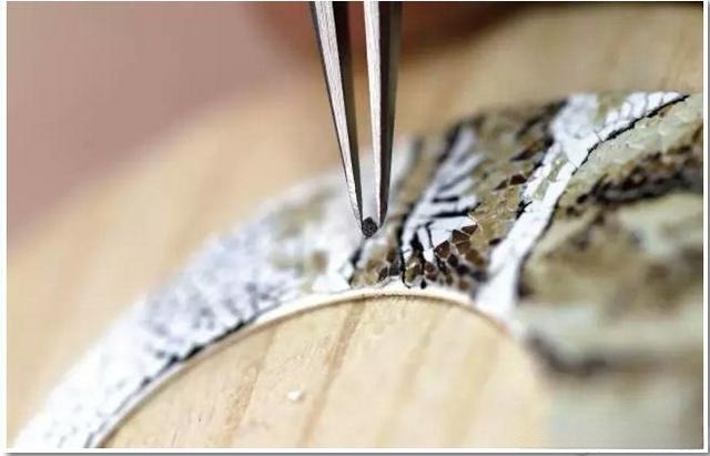 Display of quail eggs used in wood marquetry in watchmaking, showing unique natural patterns