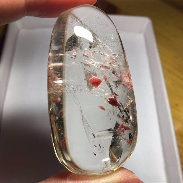 Quartz crystal containing a rare single rhodochrosite crystal resembling a chilled watermelon slice encased in ice