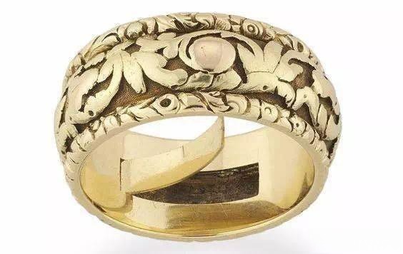 Ring featuring a small hidden compartment, demonstrating intricate mechanical jewelry design and secret storage