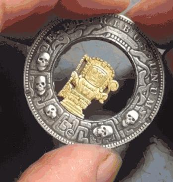 Roman Booteen’s engraved coin featuring a pharaoh holding a scepter, showcasing intricate mechanical art and fine craftsmanship.