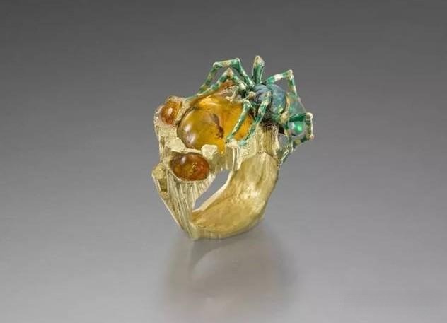 Gold ring featuring a spider design, showcasing dark-romantic style and intricate artistic craftsmanship