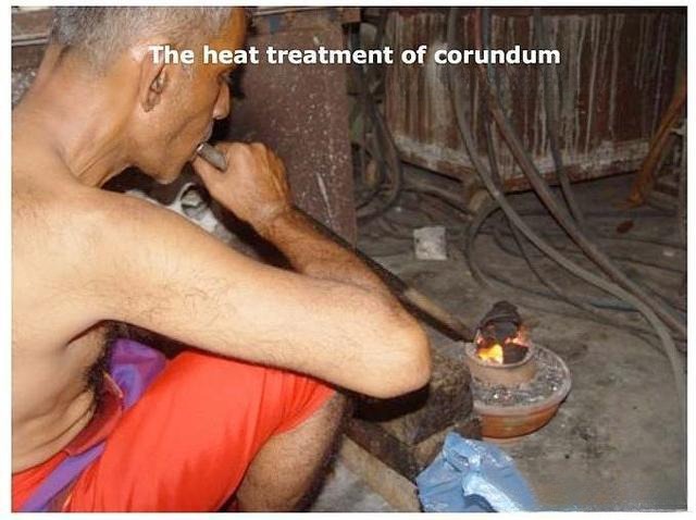 Sri Lankan artisan heating corundum using traditional coconut shell method