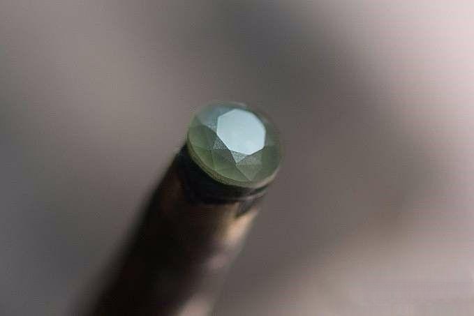 Star-shaped small facets near the table of the gemstone completed, showcasing intricate detail before final polishing