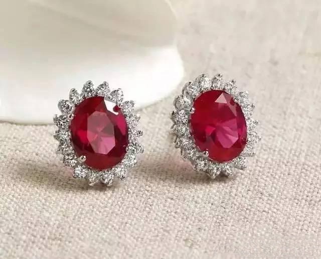 Synthetic ruby stud earrings, showing uniform color and clarity, an affordable alternative to natural rubies – Ruby Buying Guide.
