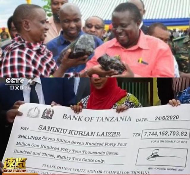 A humble Tanzanian miner holding two massive Tanzanite gemstones he discovered, weighing 9.3 kg and 5.1 kg.