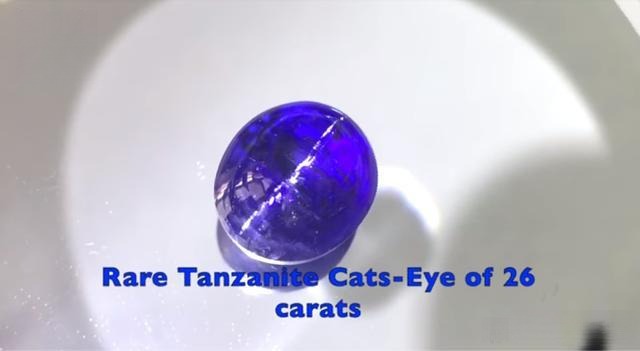 26-carat Tanzanite cat’s-eye gemstone showing a rare chatoyancy effect and rich violet-blue color