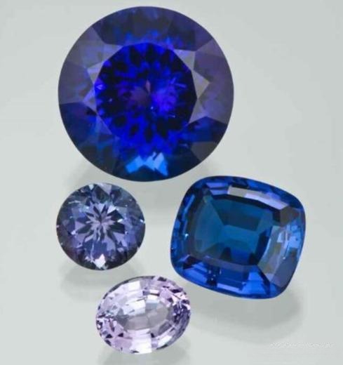 Tanzanite gemstones in various cuts and shapes, showcasing their vibrant violet-blue hues and natural brilliance