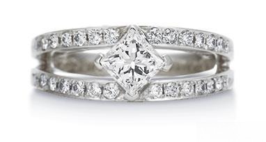 A ring featuring a V-shaped prong setting design, with the diamond held securely by prongs in a sharp, elegant V shape, adding a modern touch to the ring.