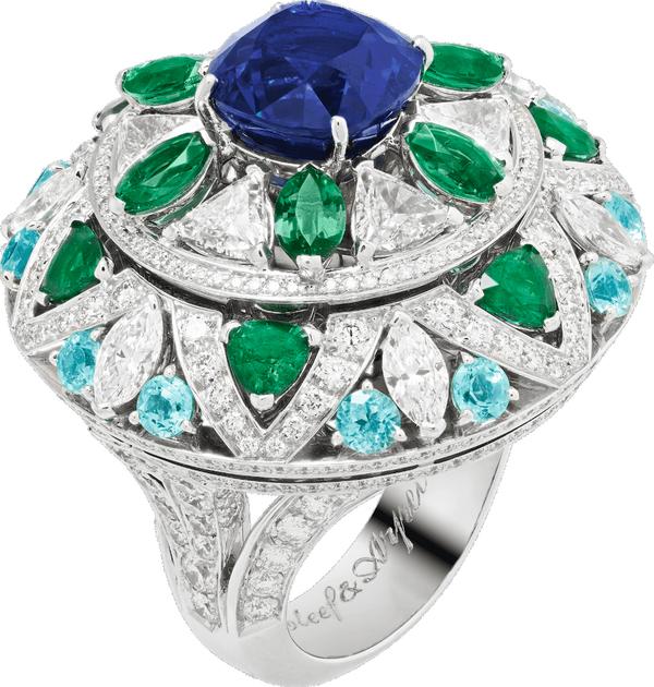 Close-up of a sapphire and diamond ring from Van Cleef & Arpels Le Secret collection, showing its delicate design and hidden features .