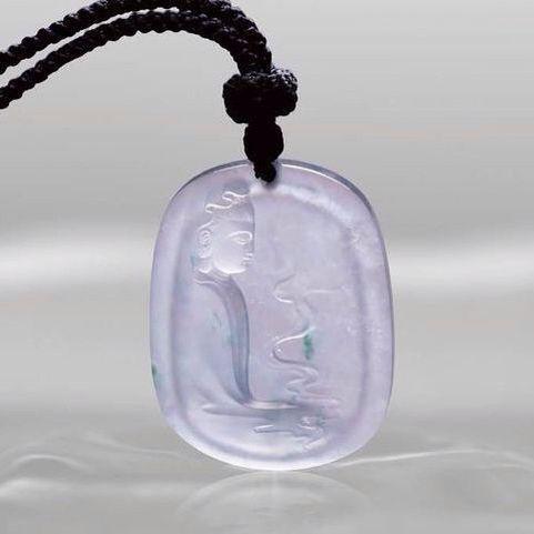 Buddha pendant carved from jadeite with vibrant, pure green color and flawless saturation, a stunning and meticulously crafted jewelry piece.