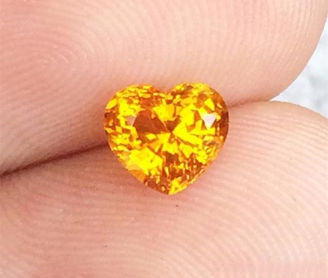 Close-up of a yellow heart-shaped gemstone showing vivid color—the key factor that inspires imagination in the 4C grading standard.