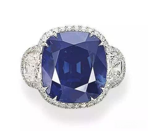 A magnificent ring featuring a 42.28-carat cushion-cut Kashmir sapphire, renowned for its saturated, velvety cornflower blue color.
