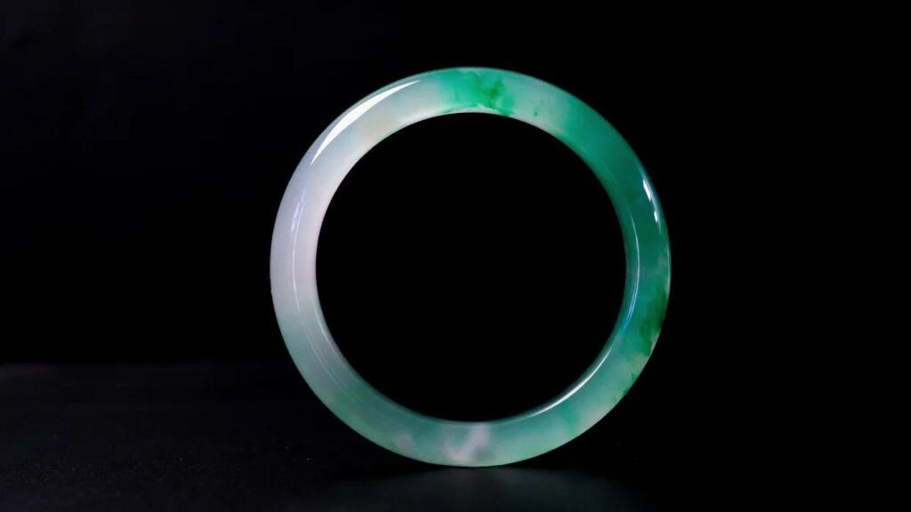 African Jade bangle, an affordable alternative to jadeite with elegant green tones.
