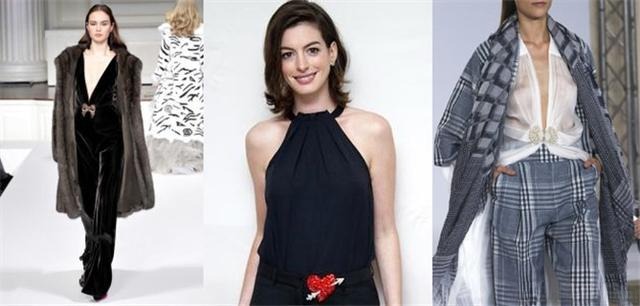 Brooch worn at the center of the belt, becoming the focal point of the outfit and adding a unique, stylish touch.