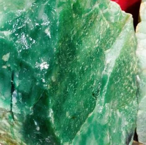 Dulong Jade Rough - Coarse-grained quartzite with visible granular structure, characteristic of Dulong Jade's natural texture.
