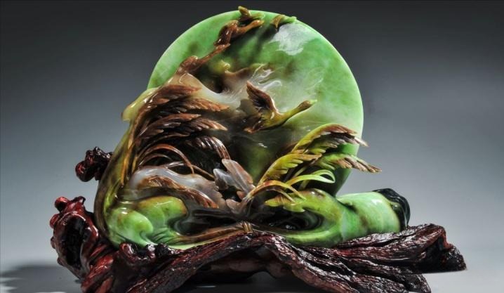 Detailed jade carving titled "Autumn Water Long Sky," featuring smooth, vibrant colors and minimal visible impurities.