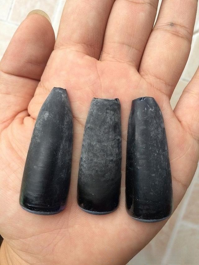 Flame-fusion (Verneuil) synthetic corundum, demonstrating the type of common synthetic gemstone material found in origin markets, often mistaken for natural gems.