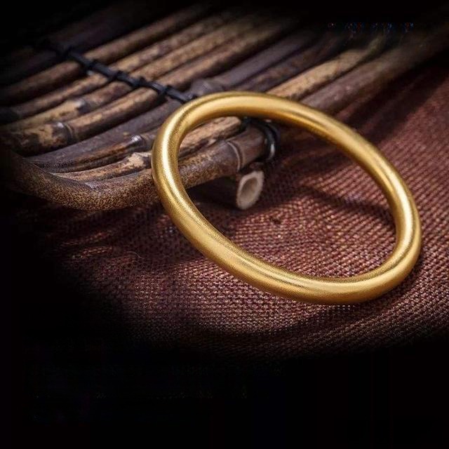 A handcrafted Chinese Gu Fa Gold bracelet showcasing traditional techniques and vintage elegance