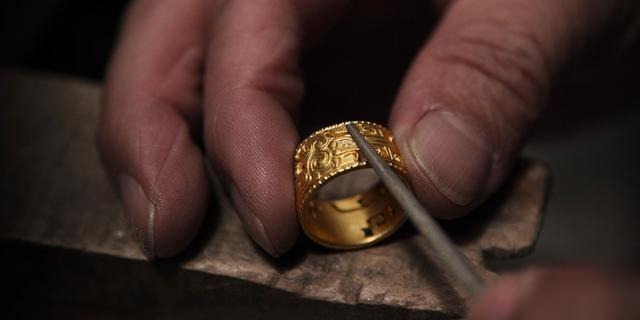 Hand-polished gold ring with subtle matte finish, showcasing traditional handcrafted polishing techniques without overly shiny surface