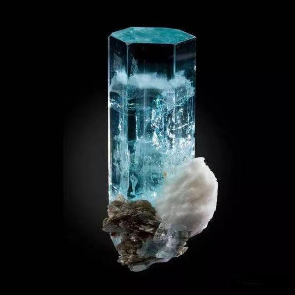 A specimen of rough, pale blue Aquamarine crystal, highlighting a raw mineral form typical of Indian specialty gemstones.