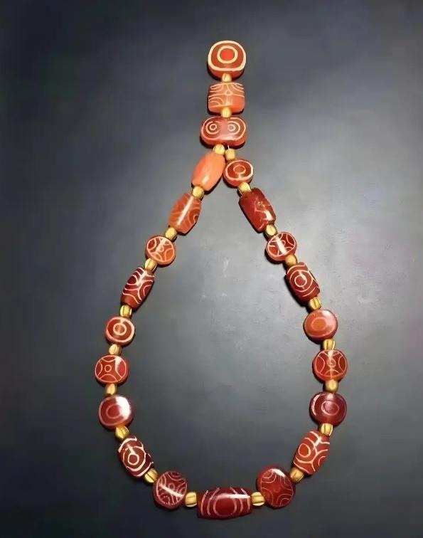 Indus Valley beaded necklace with etched agate beads, representing ancient craftsmanship.