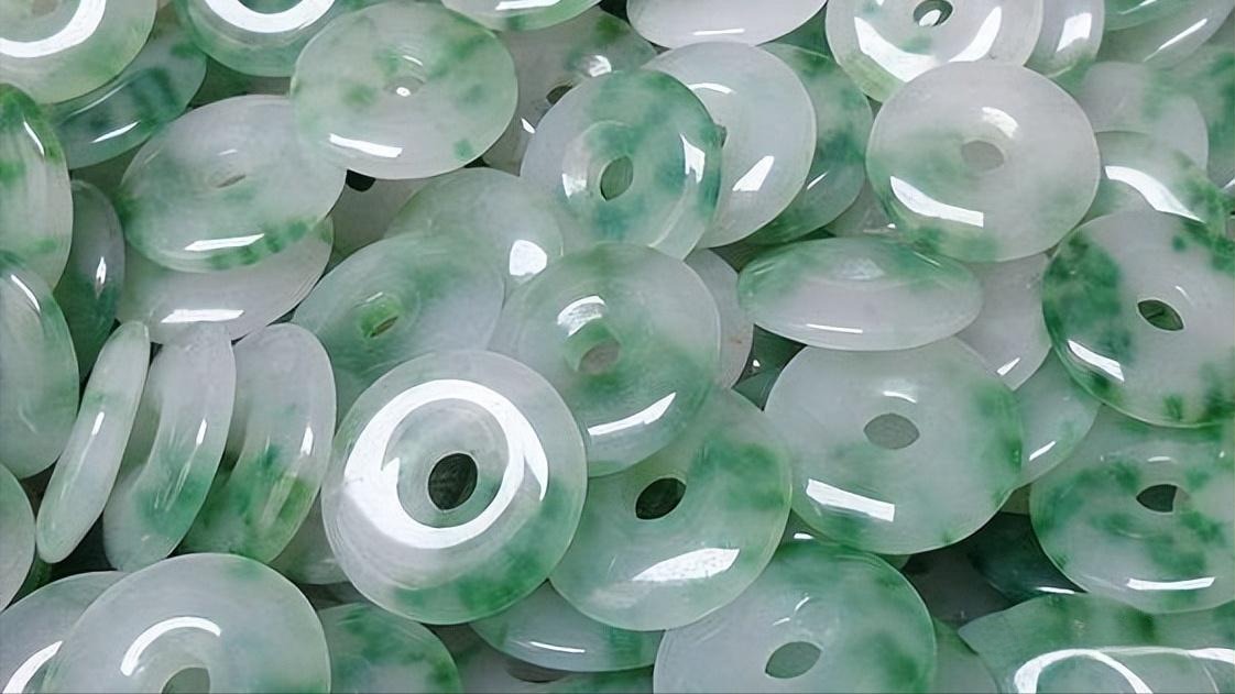 Mass-produced B+C grade Jadeite pendants, acid-washed and filled with colored resin to artificially add color and improve transparency.