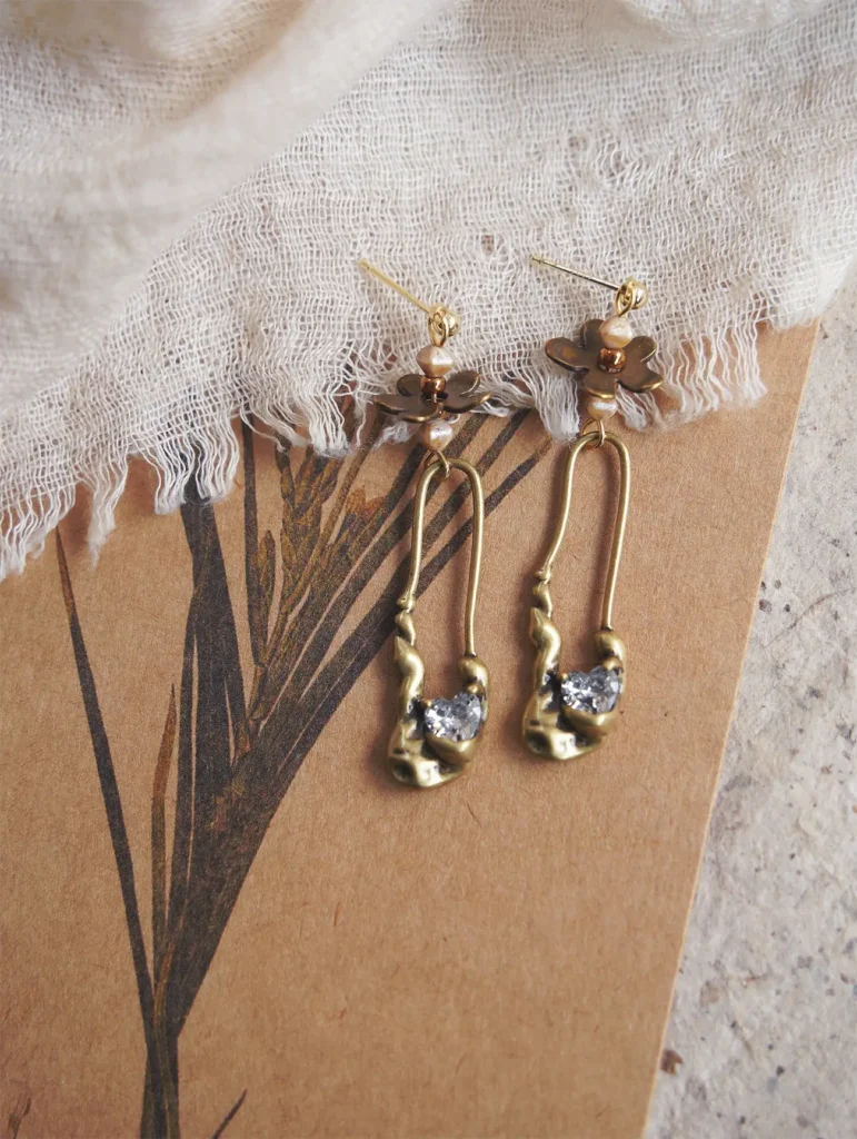 Jewea handcrafted antique brass earrings styled for casual daytime wear.