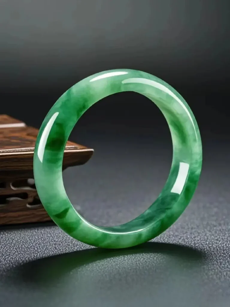 Jewea natural quartz bangle featuring unique green inclusions and a smooth polished finish.