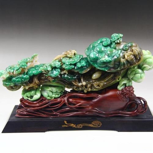 GreenDushan Jade ornament in mixed green hues, featuring characteristic grayish-green and yellowish-green patches.