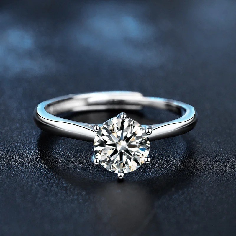 Close-up of a moissanite engagement ring showcasing its sparkling fire and brilliance.