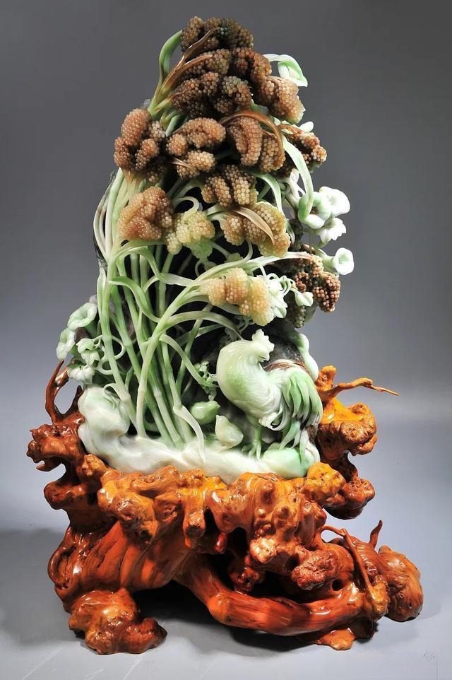 Detailed jade carving ornament where the stone clearly displays three or more distinct colors across the surface.