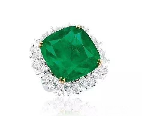 A ring featuring a 2.89 carat natural Colombian Muzo Green emerald center stone surrounded by 5.97 carats of diamonds.