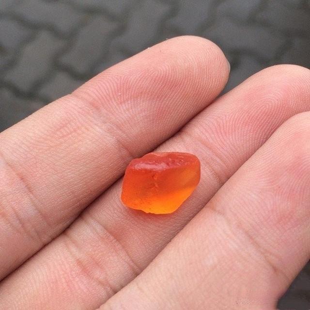 A beautiful, high-quality Ceylon Sapphire gem elegantly displayed in a palm, symbolizing the desirable and often elusive top-tier Sri Lankan gemstones.