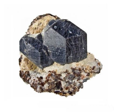 Sapphirine crystal with brown mica and white calcite inclusions.