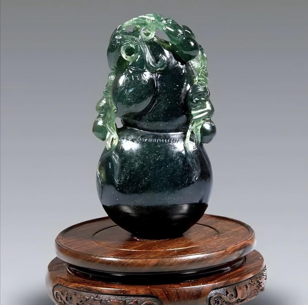 Taishan Jade carving (serpentine) with color and texture similar to the high-value Hetian Jade 'Biyu' (Spinach Jade).