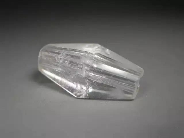 A white crystal stone, clear as water and hard as jade, symbolizing purity and strength.