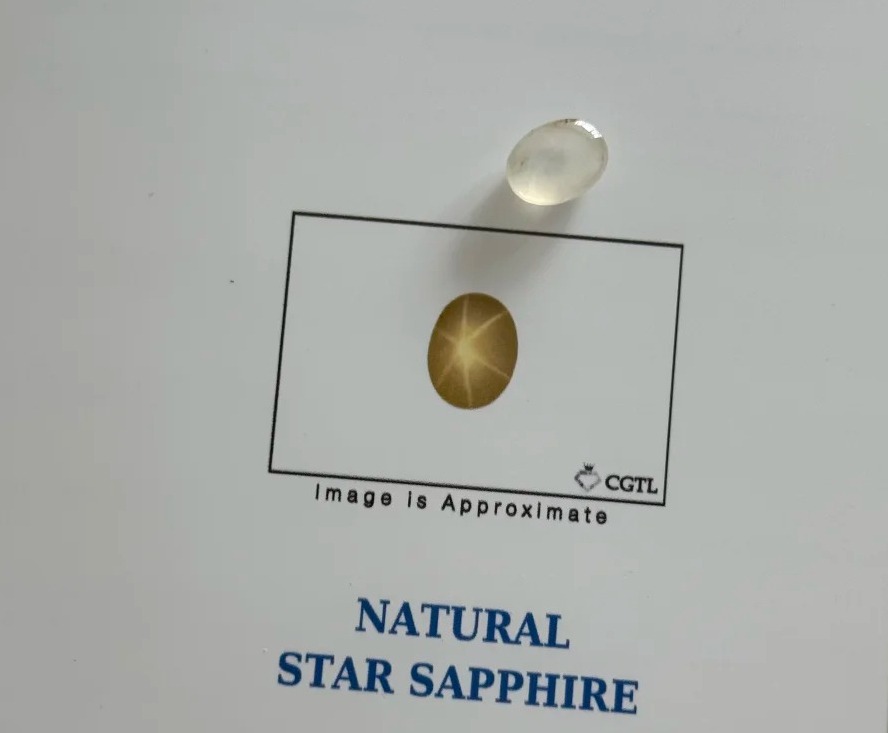 5.37-carat natural unheated star yellow sapphire after fading compared with its original certificate color